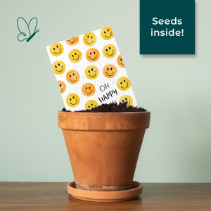 Growing paper card with smileys in a pot